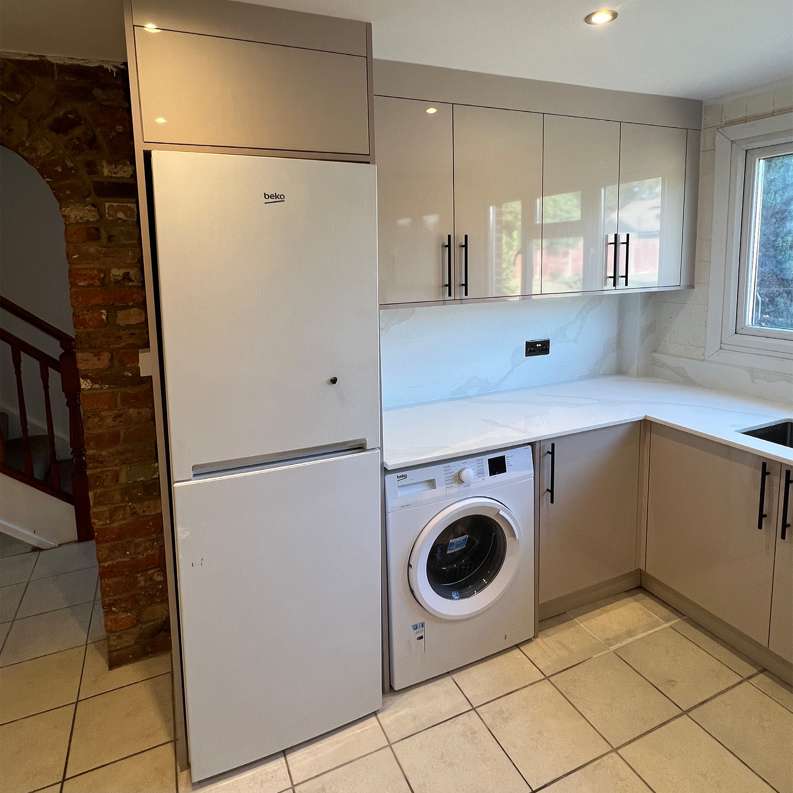 Compact modern kitchen with integrated appliances and efficient storage solutions